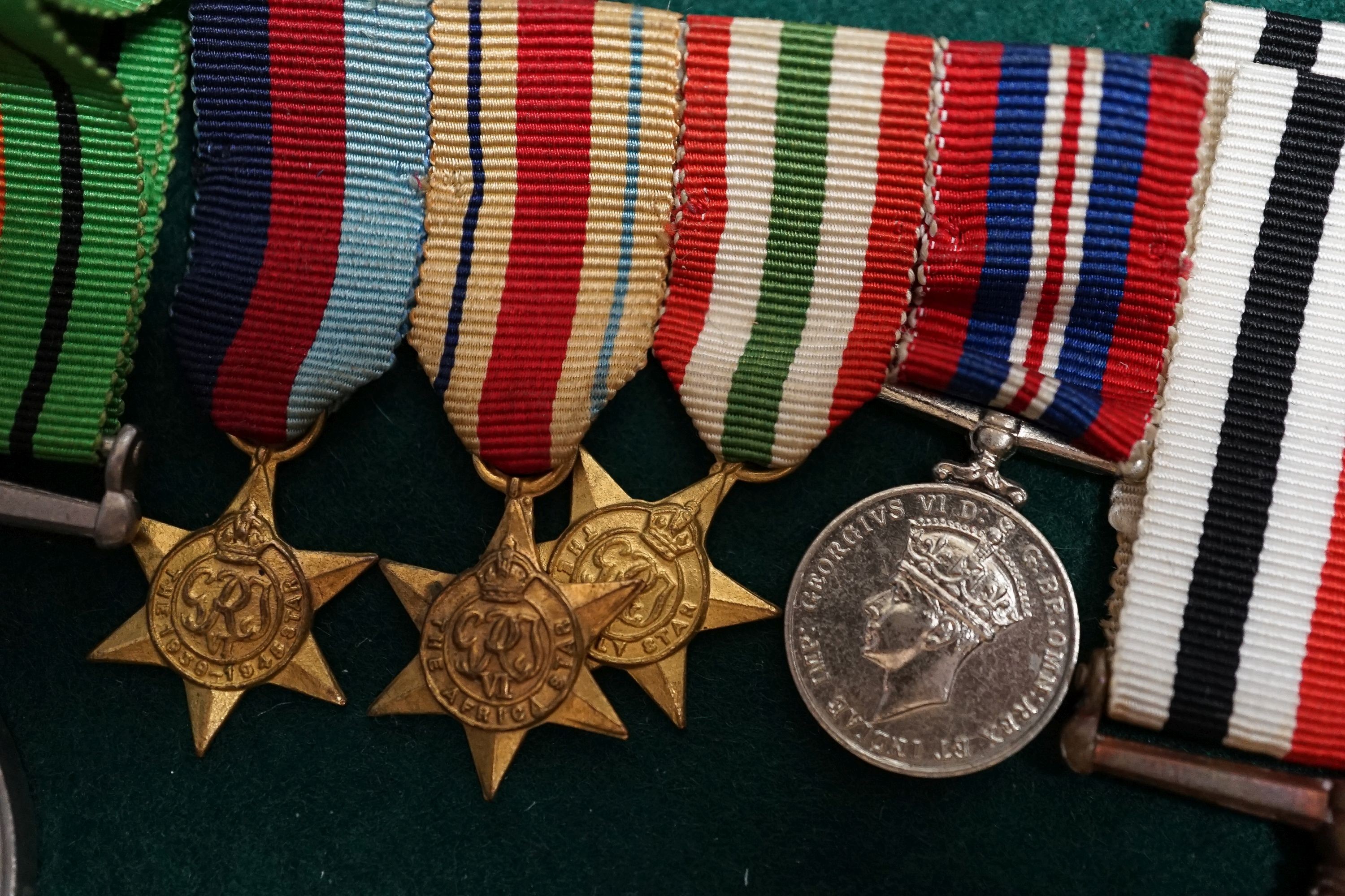 A George VI Efficiency medal to 885238 SJT. R. .BURRIDGE .R.A. various unnamed WW2 medals and miniatures